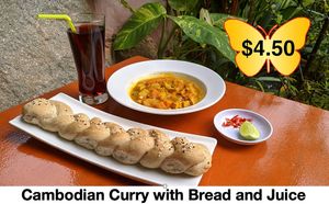 Delicious Cambodian Curry with wholegrain bread roll and juice of choice. at Butterfly Paradise  in Siem Reap