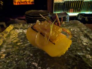 11 - Apple & Cheddar - 
Braised Apple, Glazed Onion, Cheese Crisp, Chives, Maple Thyme Shoyu
 at Omakaseed in New York City