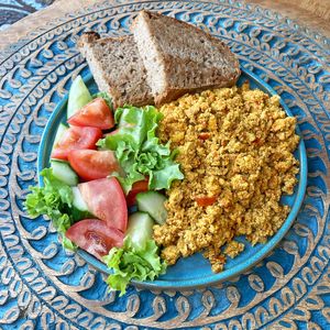Tofu & tomato scramble.
Savory tofu and tomatoes scramble with fresh salad and sourdough bread. at Dervish in Berlin