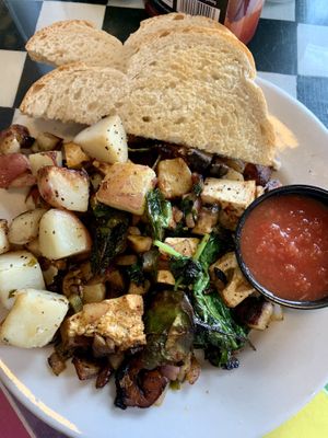 Tofu scrambler with breakfast potatoes and sourdough  at Cathedral Cafe in Fayetteville