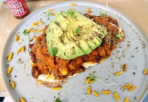 Beans on toast with avocado   at Flat White Specialty Coffee - Al Hilal in Doha