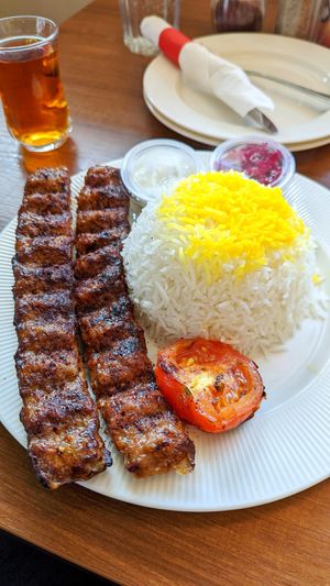 Plant based koobide kebab with saffron rice and grilled tomato at Celeshmet in Vancouver