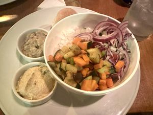 Delicious and fresh veggie bowl with hummus and baba ganoush on the side   at Casa Abierta in Leon