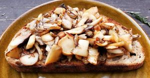 King Oyster and Maitake mushrooms sautéed with butter and garlic on a delicious toasted slice of bread. at Martinez Farmers' Market in Martinez