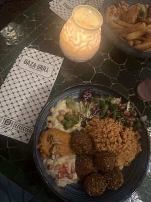 Falafel bowl with hummus, baba ganoush, muhammara, bulgar and pomegranate dressing.  at Gaza Grill Kødbyen in Copenhagen