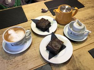 Chocolate orange cake and oat milk latte   at The Fountain Tea Rooms in Bonsall