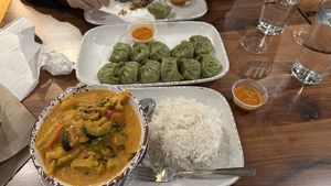 Mixed vegetable curry and vegan made veggie MOMO   at The Market At Malcolm Yards in Minneapolis