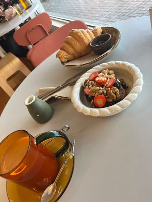 Chai tea, plain croissant and loaded banana bread.   at The Gator Club in College Park