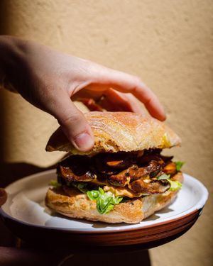 Miso glazed portobello mushroom burger with lettuce, tomato & kimchi mayo ( Vegan & GF option ) at Idle Hands in Girona