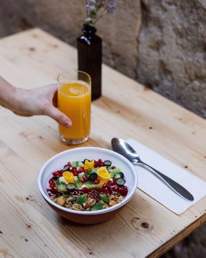 home made granola with fresh seasonal fruit and coconut yoghurt (Vegan) at Idle Hands in Girona