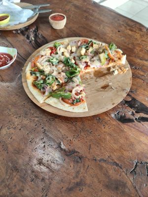 Dairy cheese (non vegan) in vegan pizza and Mexican wrap. at Pondok Murini in Ubud