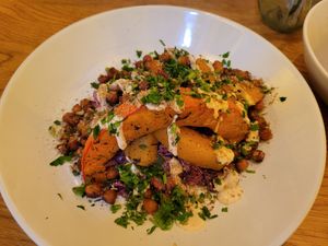 Roasted pumpkin with chickpeas and coleslaw at HAPPA Restaurant in Berlin