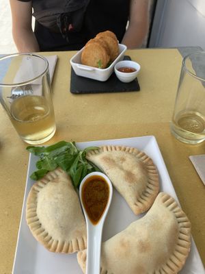 Empanadas (onions and potatoes) and nuggets with potatoes and vegan cheese   at Organic Lovers Torino in Turin