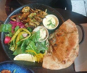 VEGAN SHAWARMA: Marinated in Bill's blend of herbs & spices. Served with garlic flatbread, chopped salad, house pickles, chillies, mint yoghurt & Hummus at Bill's in Manchester