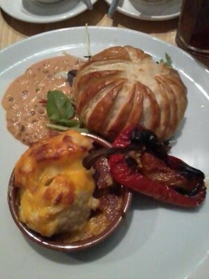 Cheese and Spinach Pithivier with Roasted Peppers and Sauce at Sky Apple Cafe in Newcastle Upon Tyne