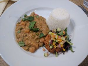 Vegan Xinxim Curry [£9.40] – Brazilian/African curry with peanuts, coconut milk, peppers, butternut squash, peas & courgette with rice, black eye pea fritter & molho a campanha at Sky Apple Cafe in Newcastle Upon Tyne