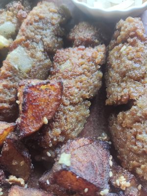 Ghastly food.  I had asked the server to recommend a Serbian dish for me and was offered Cevapi.  What came was some bland (millet?) patties drenched in old tasting oil that had st at Vikasha Lounge  in Belgrade