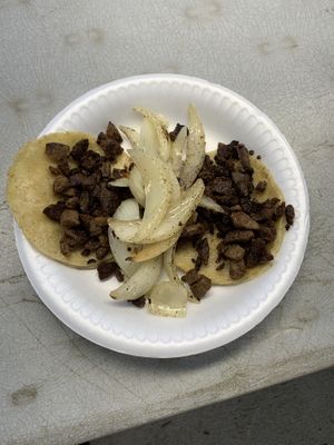 Finished soy asada taco with grilled onions   at hippiestacos in Long Beach