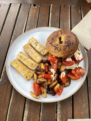 Sourdough bagel w/ Tomato + mushroom + vegan cream cheese. Soooo good!!!  at Lazy Bird in Koh Lanta