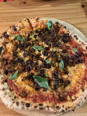 Pizza with vegan cheese, olives and roasted aubergine. SO good.  at Solo Grano in Nottingham