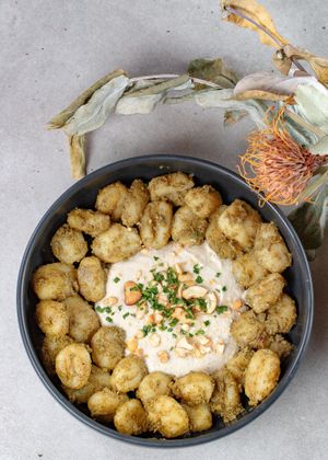 Gnocchi tossed in a tangy pesto of cilantro, garlic, and walnuts, served with a deliciously cool cream of cashews at La Escala in Tenerife
