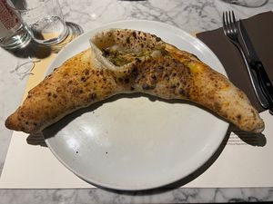 Calzone con scarole olive nere e capperi  at Peperino Pizzeria & Cucina Verace in Turin