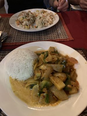 Curry and fried rice dish in the background   at Lemongrass Bistro in Kampot