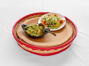 TIKIL GOMEN:  € 17	
								
Sliced cabbage, carrots and potato chunks, cooked to perfection in a mild sauce.
 at Awash Valley in The Hague