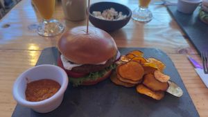 Lentil vegan burger: greasy bun, bland patty, and flavorless sides. at La Casona in San Pedro De Atacama