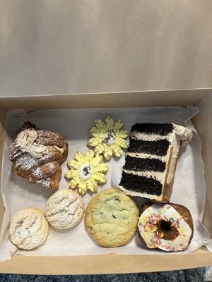 Almond croissant, selection of cookies, vanilla cronut, cookie butter chocolate cake  at Houlden's Rise Above in Tucson
