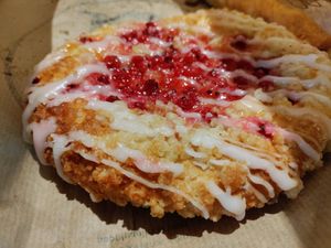 Dessert pastry topped with local berries at Backstube Tromsoe in Tromsoe