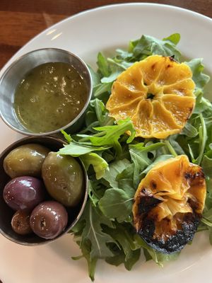 Salad course served with oily olives and dressing on the sidee  at Main Deck in Penn Yan