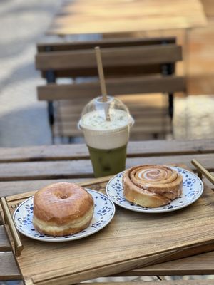 Original glazed and cinnamon bun with iced matcha latte   at Scoop 'n Dough in Cascais