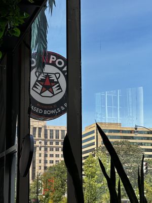 Sign at the entrance showing park across the street  at Pow Pow - I St NW  in Washington