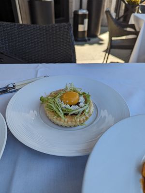 Caramelized onion tart with vegan egg yolk at Crossroads Kitchen in Calabasas