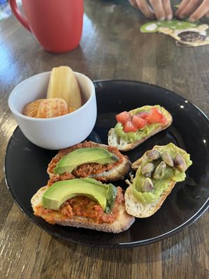 Avocado toast, modified from menu. Red pepper walnut spread, pistachios and tomato   at Chaikhana Chai in Kennett Square