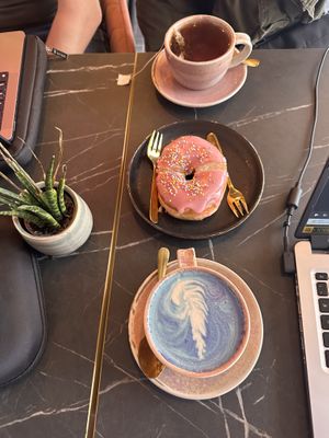 Breakfast tea, vegan donut 🍩, and butterfly 🦋 latte with oat milk   at Pink Zebra in North London