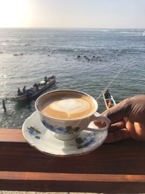 Cappuccino in front of the ocean. at CasaTeranga PlantBaseDakar in Dakar