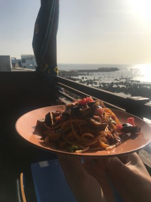 Spaghetti in front of the ocean  at CasaTeranga PlantBaseDakar in Dakar