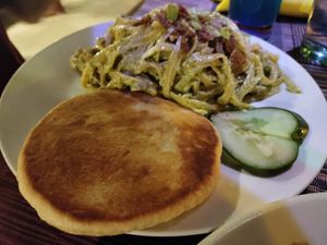 Green pasta with homemade bread at Villa Potenciana Restaurant in Malapascua Island