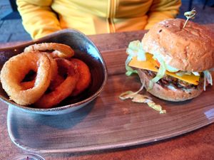 Vegan cheeseburger w/ courgette patty and onion rings at Le Burger in Innsbruck