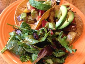 Taco option 1 for Tuesday August 9 2016 - corn tortillas filled with roasted potatoes, pica de gallo, avocado and salsa verde.  Served with a goji chipotle side salad at Cafe Gratitude in Kansas City