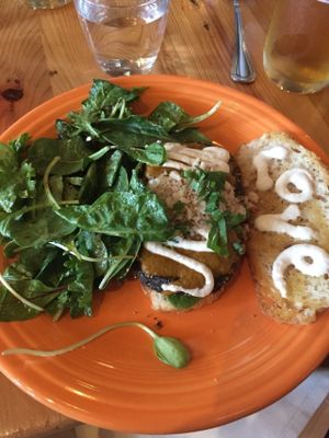 "Awesome" eggplant parm sandwhich with cashew cheese and side salad.  at Cafe Gratitude in Kansas City