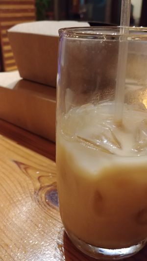 Iced coffee called Yo Soy Amor with my leftovers and an extra meal for tomorrow (Eggplant parm over spaghetti squash) called Eternally Youthful. at Cafe Gratitude in Kansas City