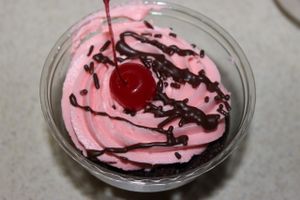 Chocolate cupcake with cherry icing. at Capital City Bakery in Austin