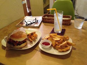 Soy meat burger with a side order of french fries, which are more potato wedges than fries.  at Morpho Cafe in Kyoto