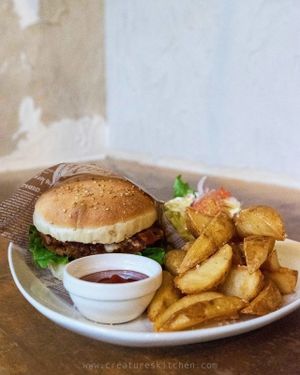 Veggie meat burger with fries and salad. at Morpho Cafe in Kyoto