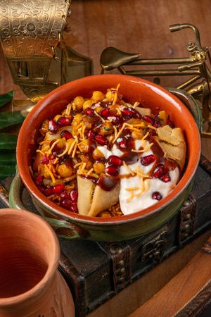 Samosa Chaat - Indian street food where crispy Punjabi samosa is topped with spicy chana, vegan yoghurt and chutney mixture. at Kaani Kaana in Chelmsford