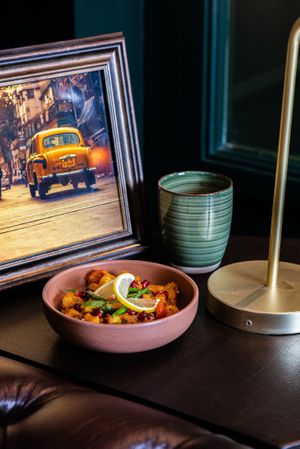 Lemon-fried diced potatoes seasoned with cumin and chaat masala, green chillies, red onion and pomegranate. Aloo Chaat is a popular Indian festival snack. at Kaani Kaana in Chelmsford