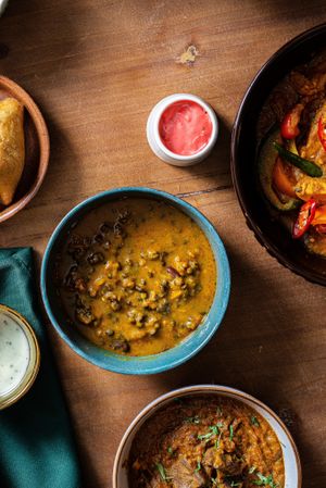 An old school dhaal made with black lentils and kidney beans. Traditionally, this is cooked slowly for hours to create the thick buttery consistency it's famous for. Also rich in p at Kaani Kaana in Chelmsford